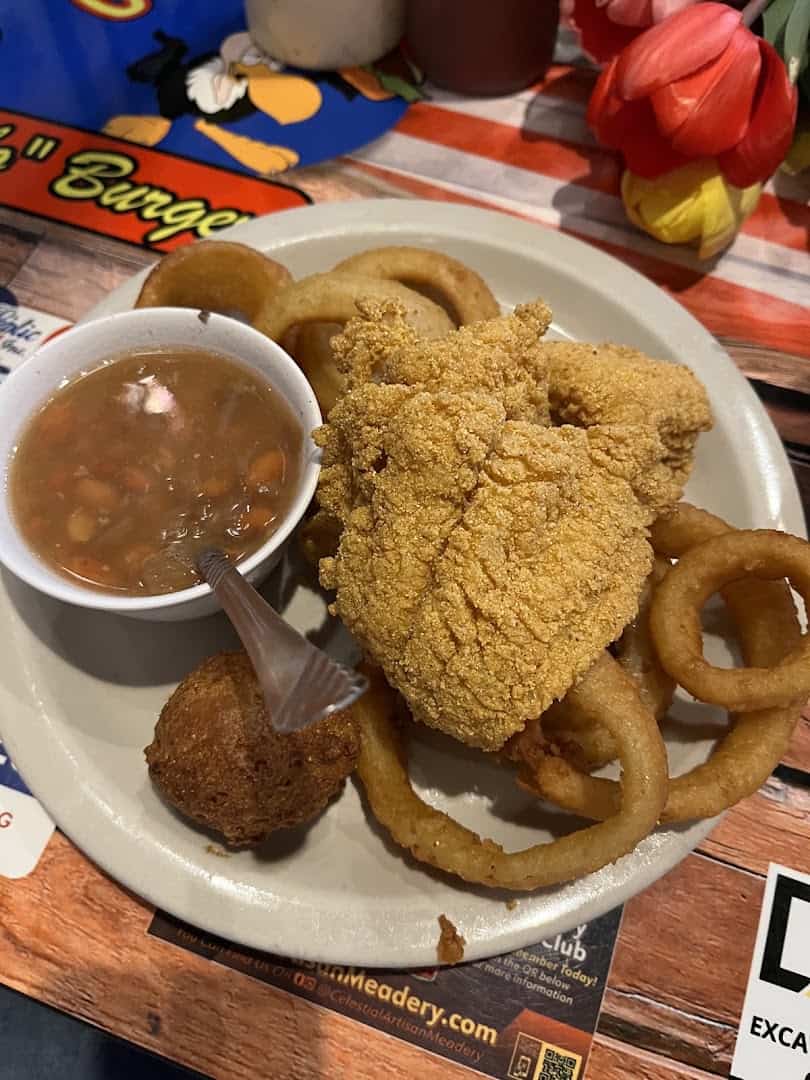 Fried catfish with onion rings, a hush puppy and beans at Bebo's and Kathy's Cafe