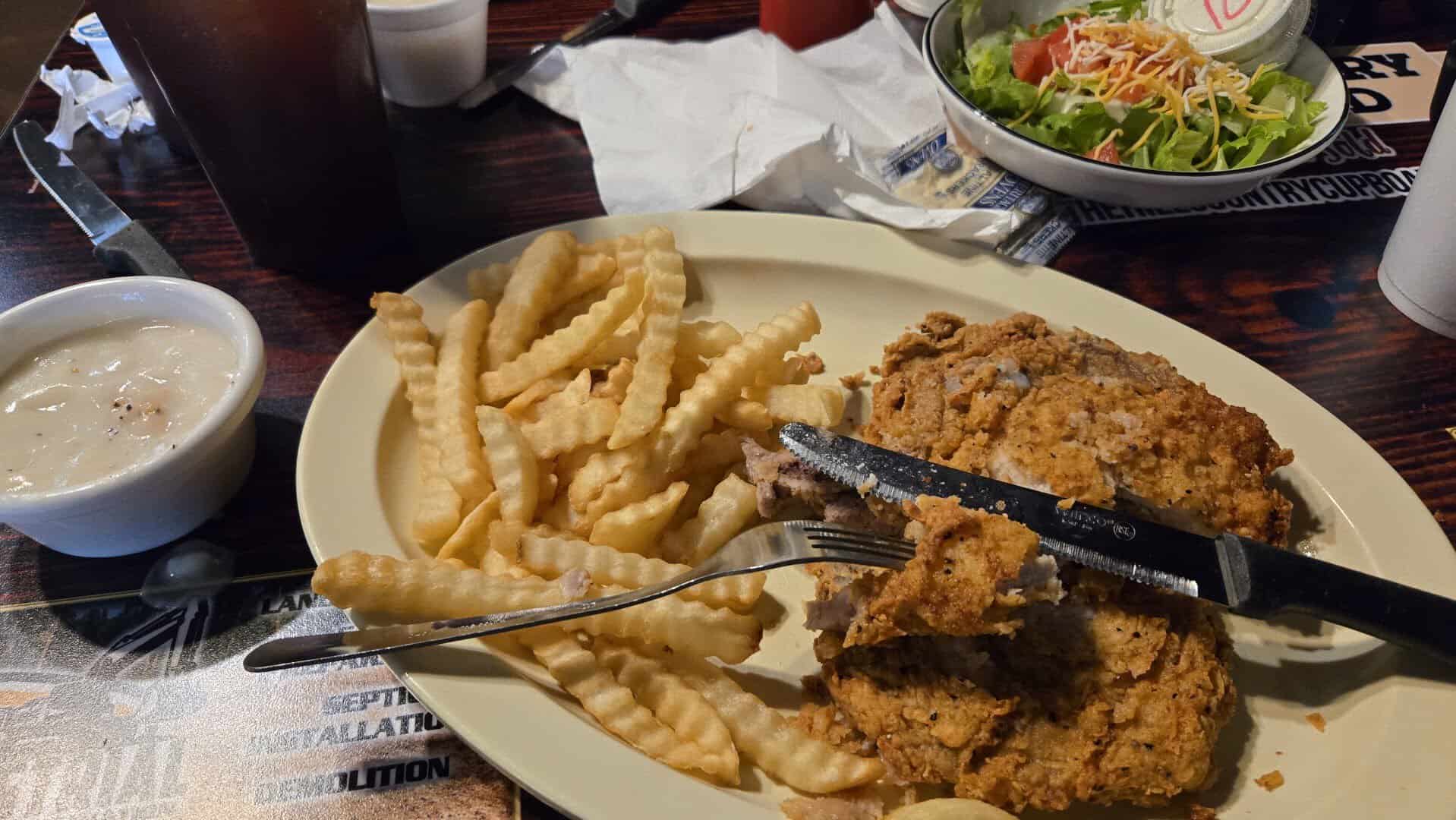 Fried catfish platter with crinkle fries, soup and salad at Hill Country Cupboard