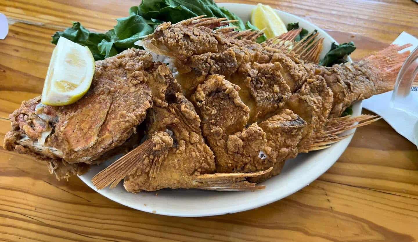 Whole fried Gulf snapper with lettuce and lemon at Stingaree Restaurant in Crystal Beach