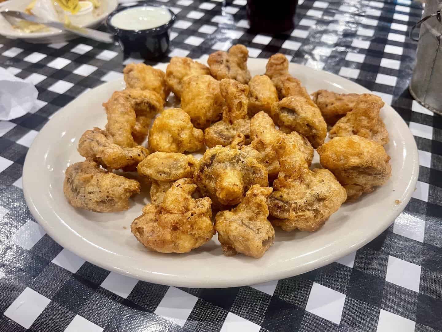 Plate of golden fried mushrooms at Mels Country Cafe in Tomball, Texas