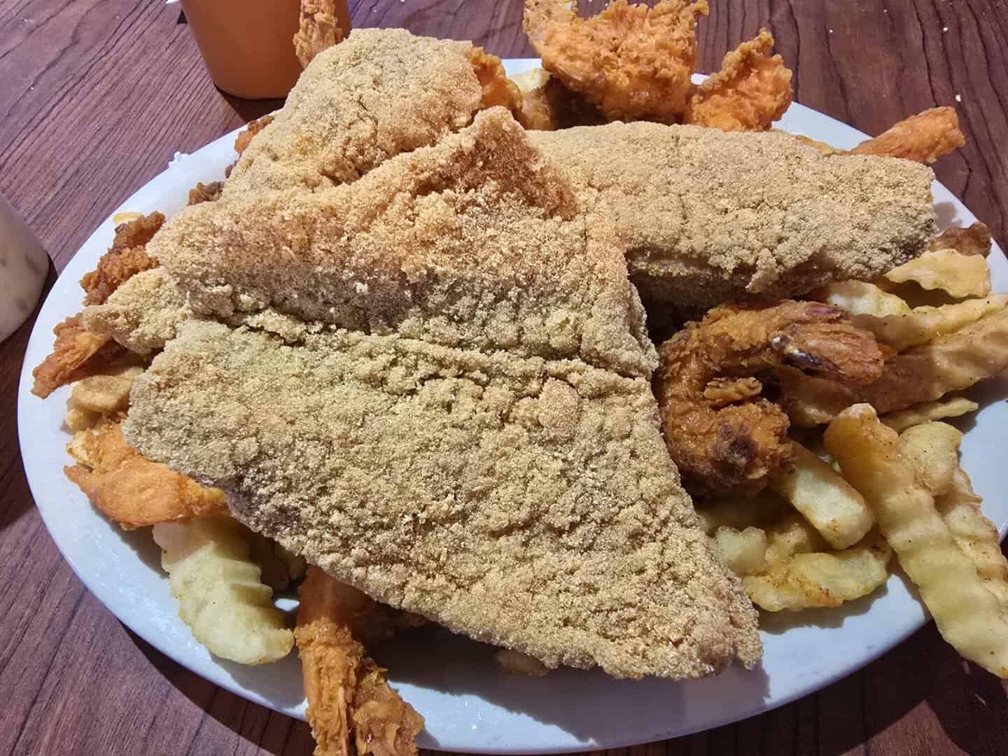 Fried seafood platter with fish and fries at Baytown Seafood in Baytown, Texas