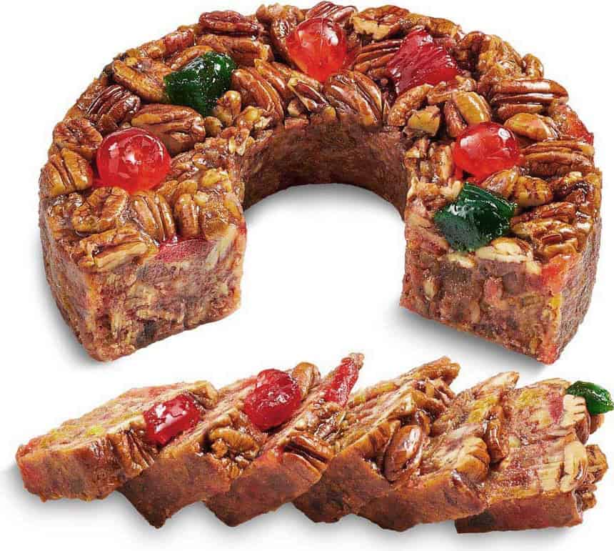 Sliced DeLuxe fruitcake ringed with pecans and cherries at Collin Street Bakery
