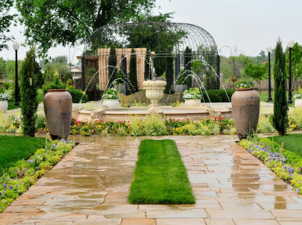 Formal fountain, lawn and cypress trees at Gage Gardens in Marathon