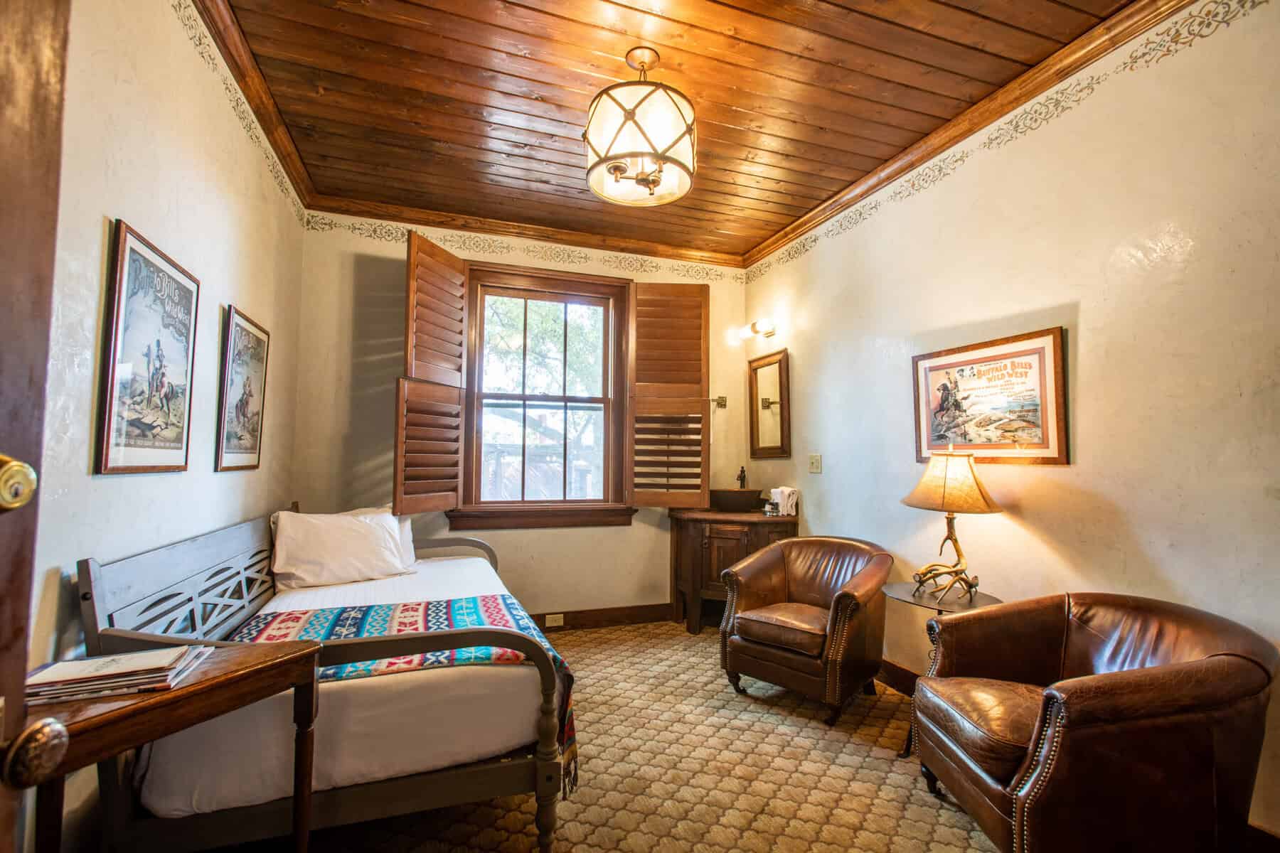 Guest room in the historic 1927 building of the Gage Hotel