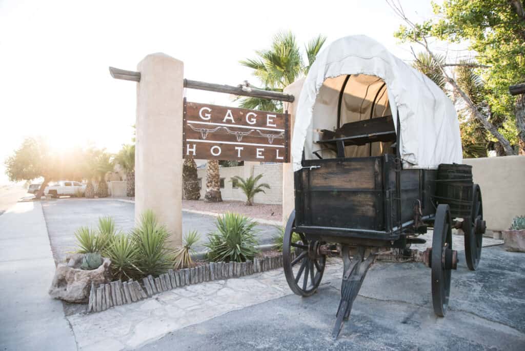 Gage Hotel sign and antique wagon in Marathon, Texas