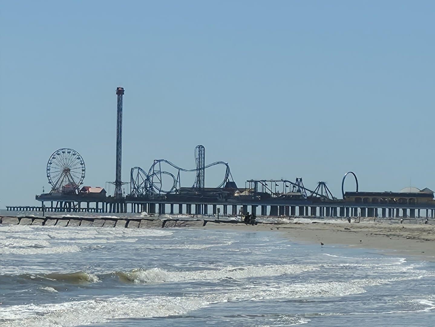 Galveston Island Historic Pleasure Pier and Gulf beach along the Seawall in Galveston, Texas