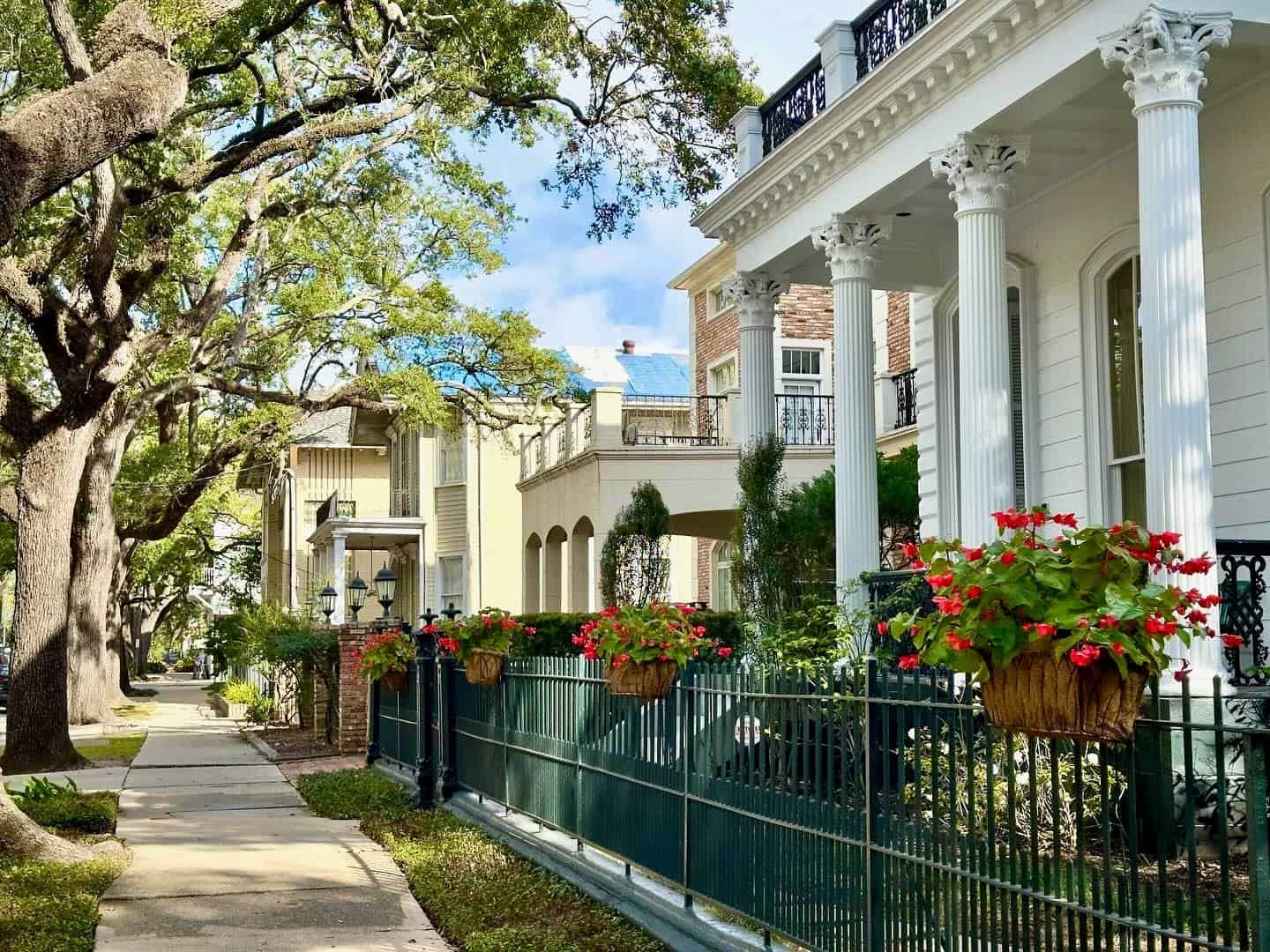 A grand columned mansion under oaks in the Garden District of New Orleans, Louisiana