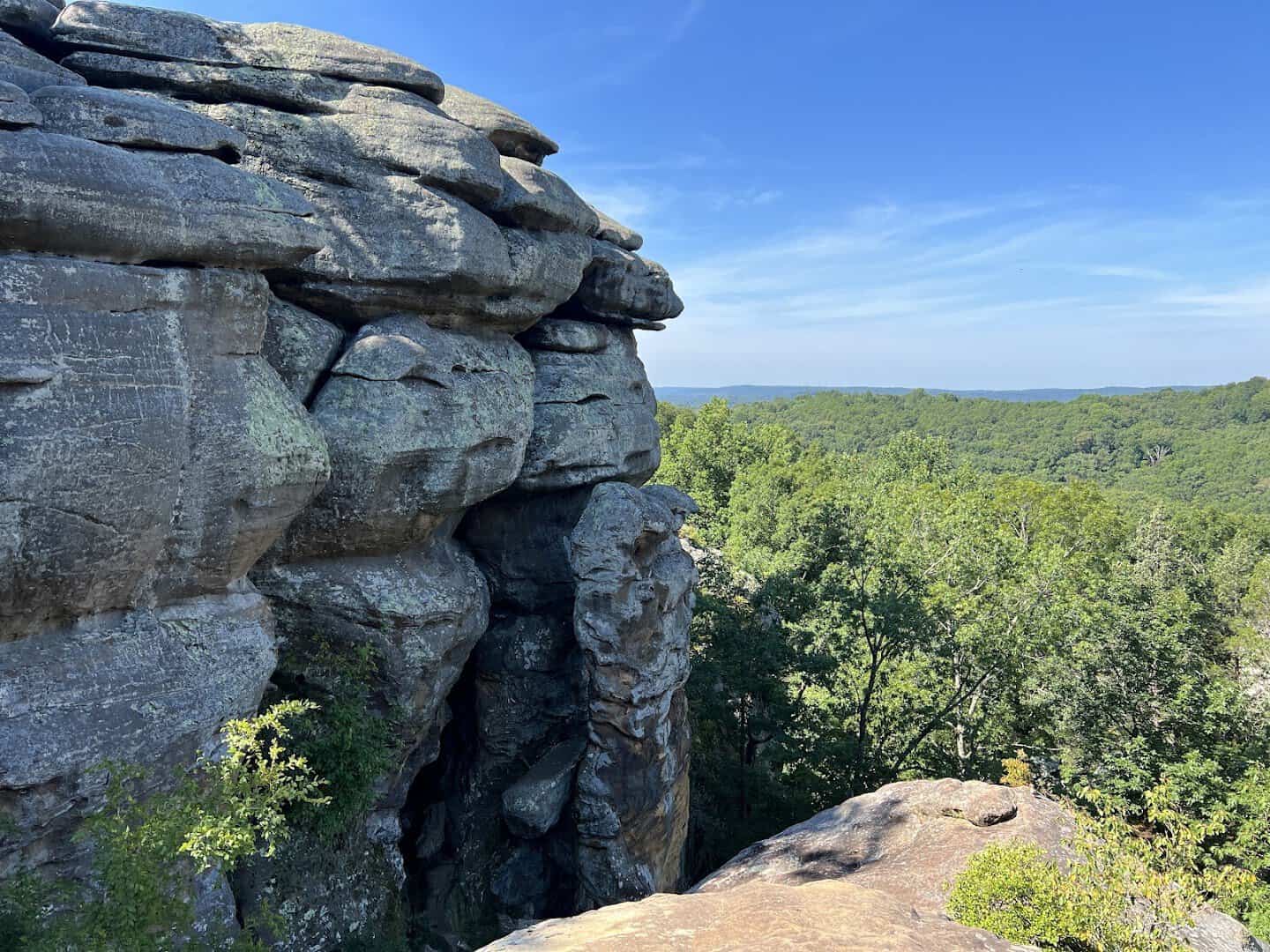 Weathered sandstone bluffs above the forested ridgeline at Garden of the Gods, Illinois