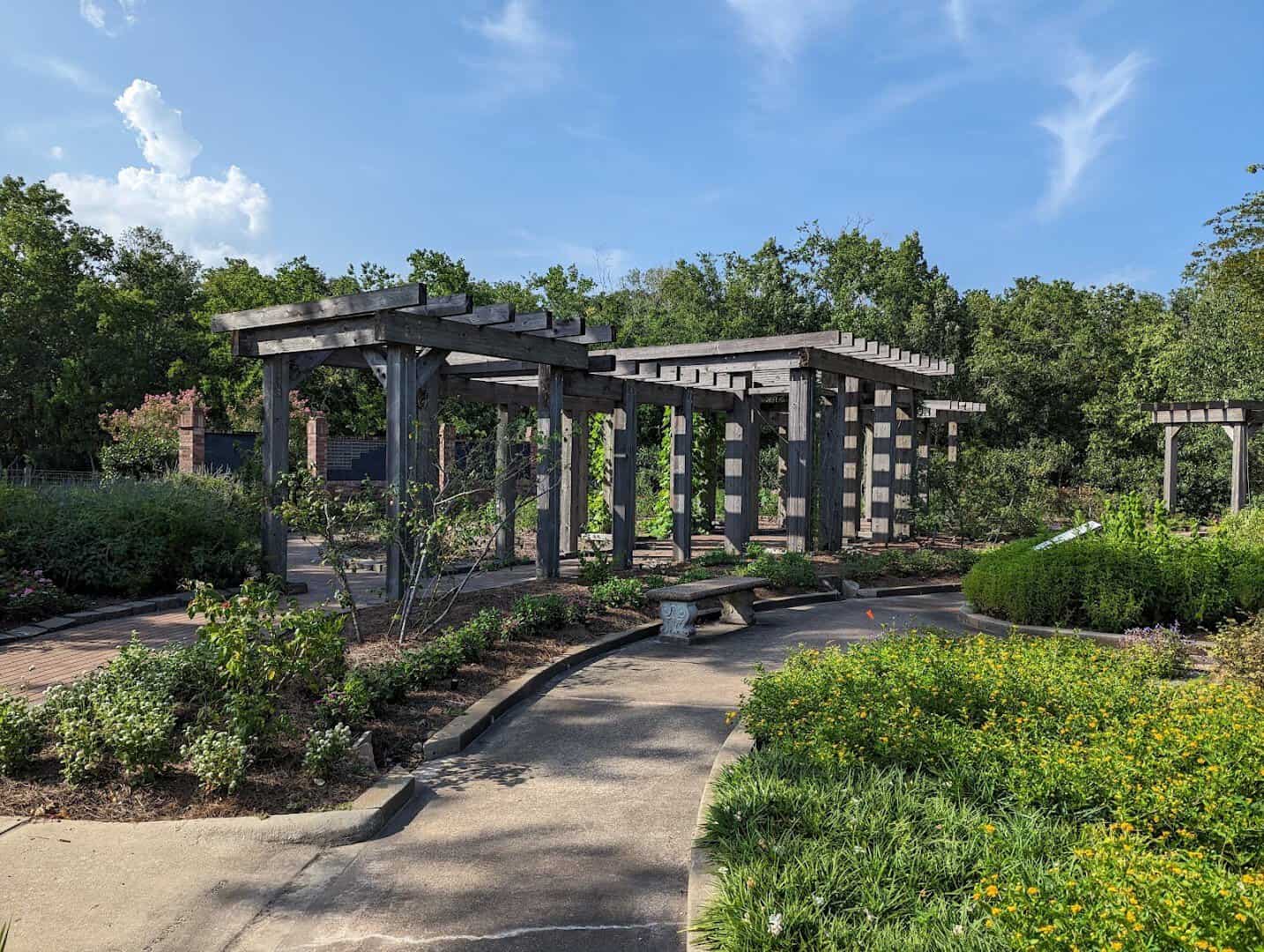 Wooden garden pergola and path at Beaumont Botanical Gardens