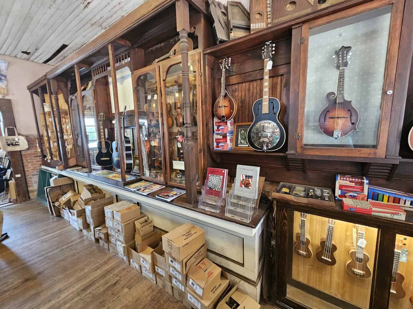 Interior of the General Mercantile and Oldtime String Shop with fiddles guitars and stocked shelves in Nacogdoches