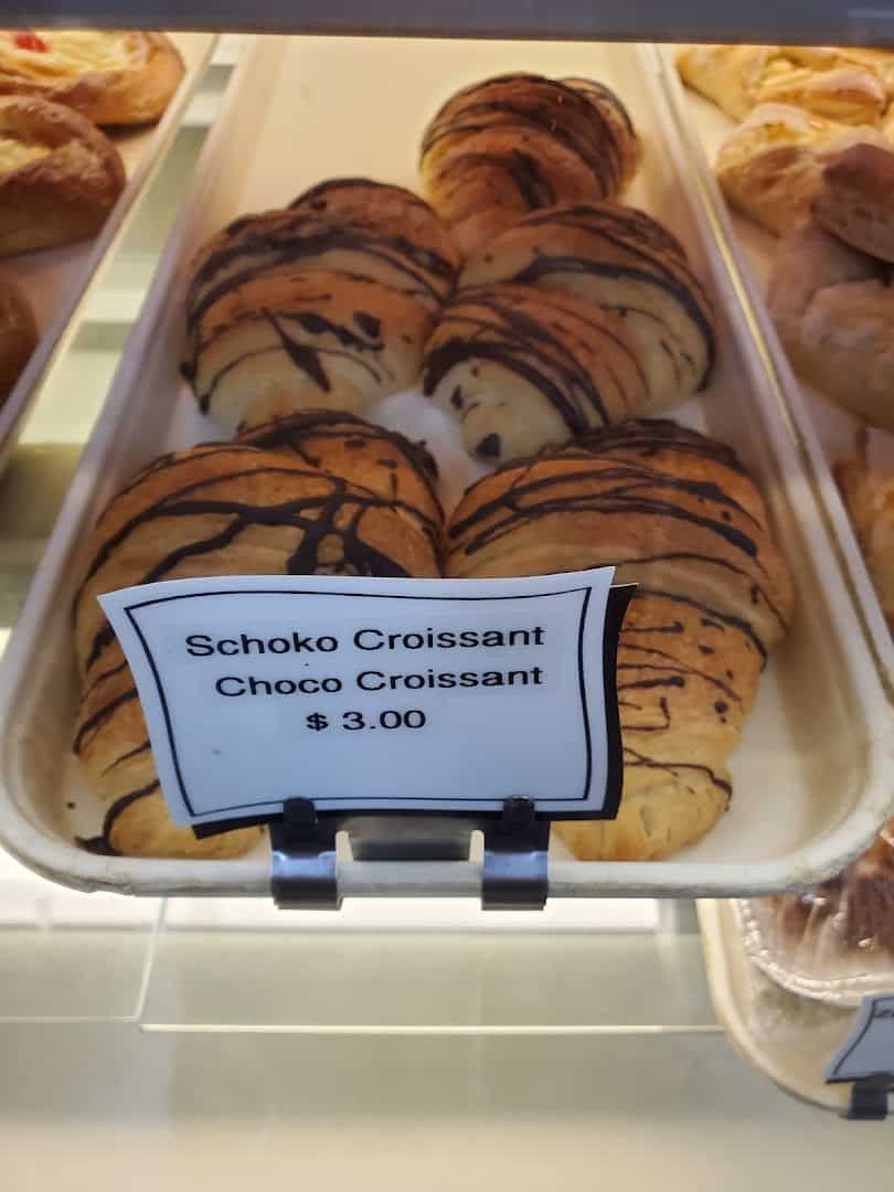 Chocolate croissants in the pastry case at Pfeifer's German Bakery