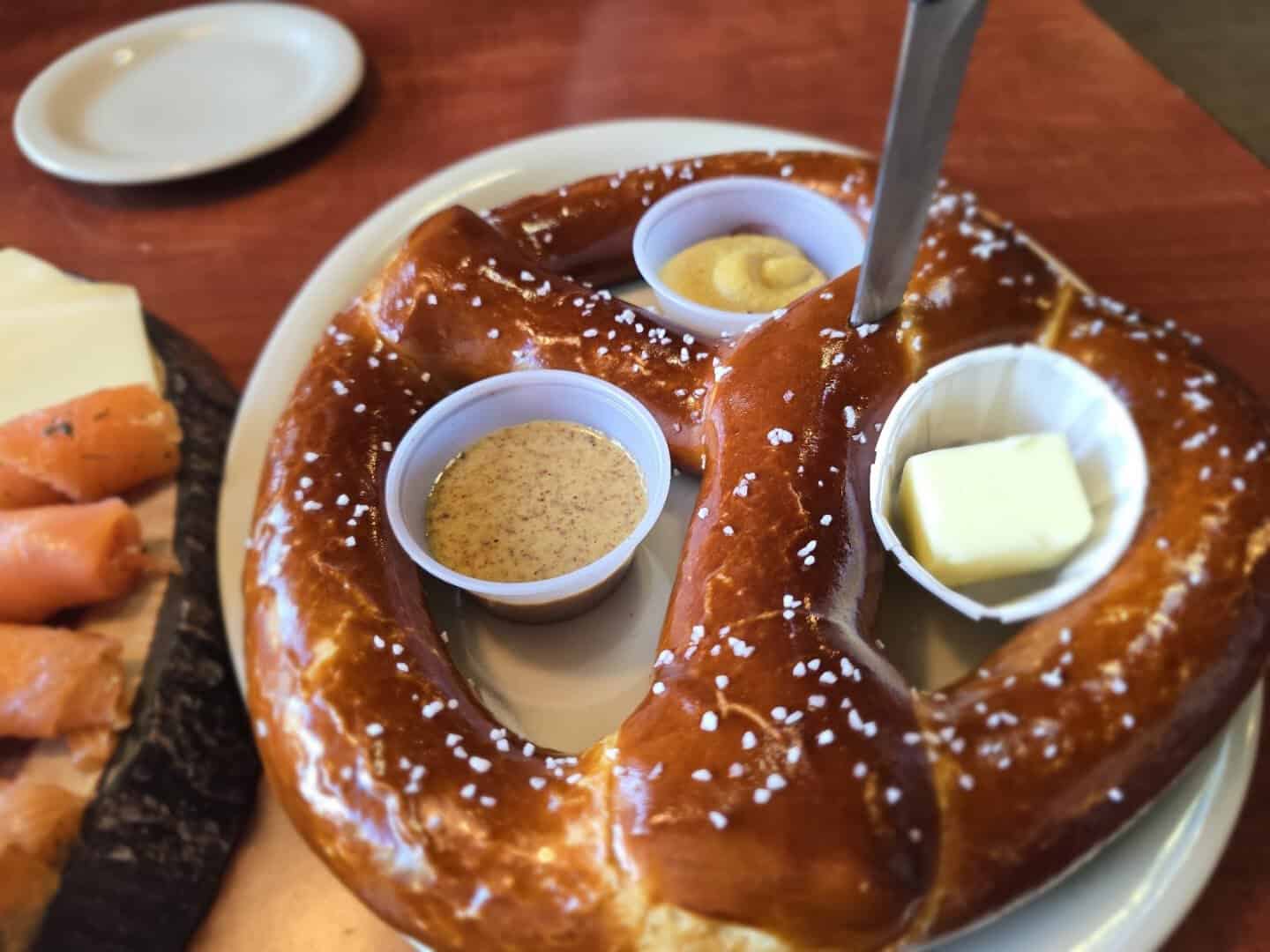 Giant soft Bavarian pretzel with mustard and butter at Bavarian Grill in Plano, Texas