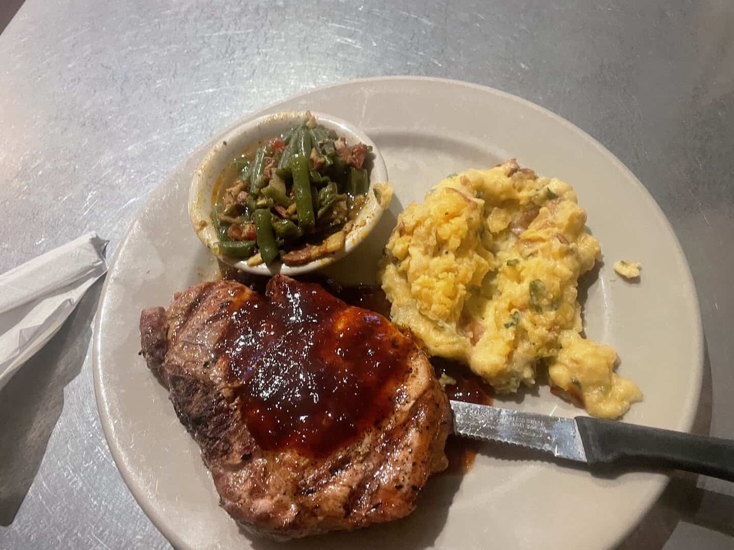 Glazed pork chop with sides at Rathskeller Bistro in Fredericksburg