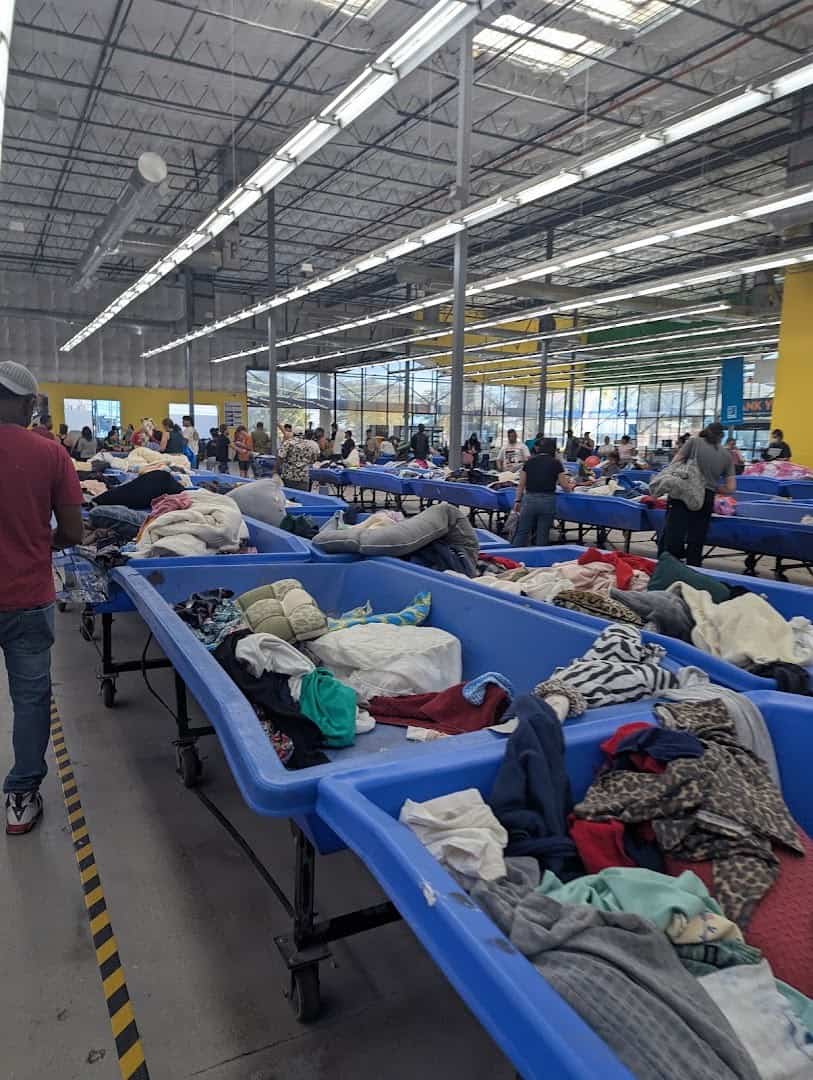 Blue bins of clothing at the Goodwill Outlet in Austin