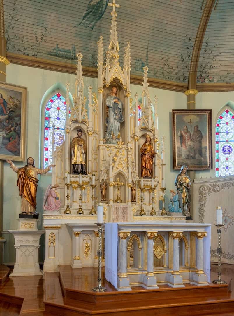 Ornate white and gold Gothic altar inside St. Mary Catholic Church in High Hill, Texas