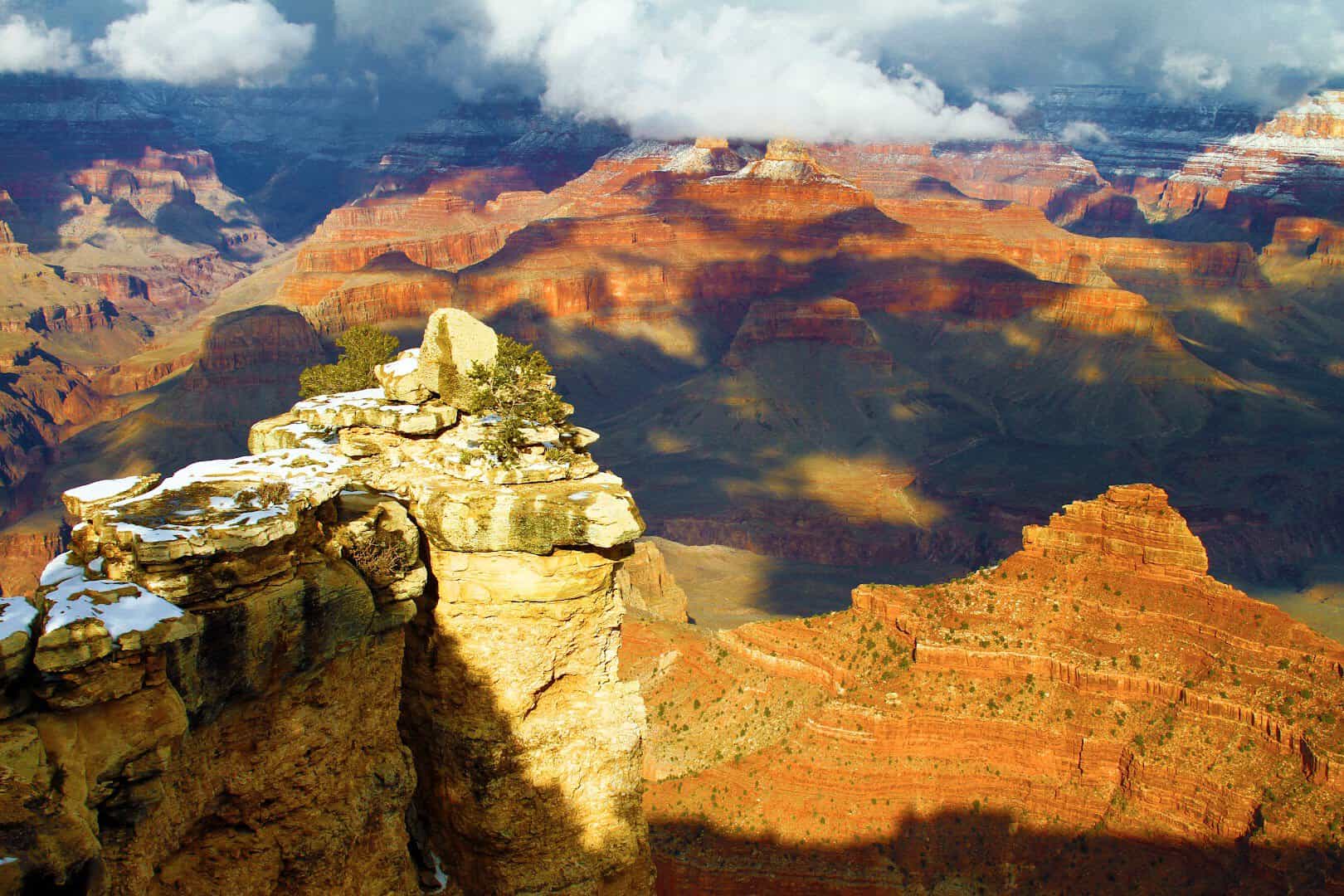 Snow dusts the red rim rocks at Mather Point, Grand Canyon National Park, Arizona, in winter