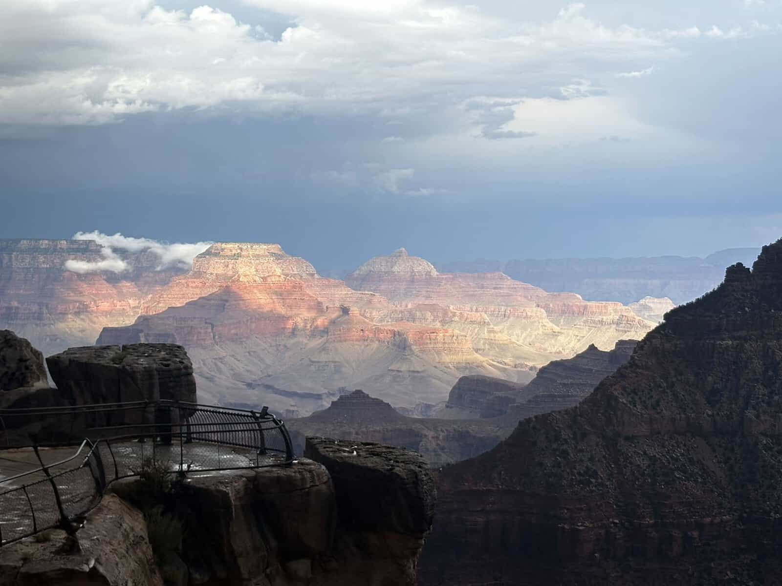 Storm light over the layered buttes of the Grand Canyon South Rim, Arizona