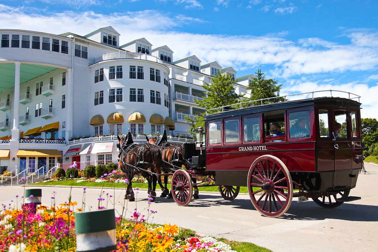 The Grand Hotel and a horse-drawn carriage on Mackinac Island, Michigan