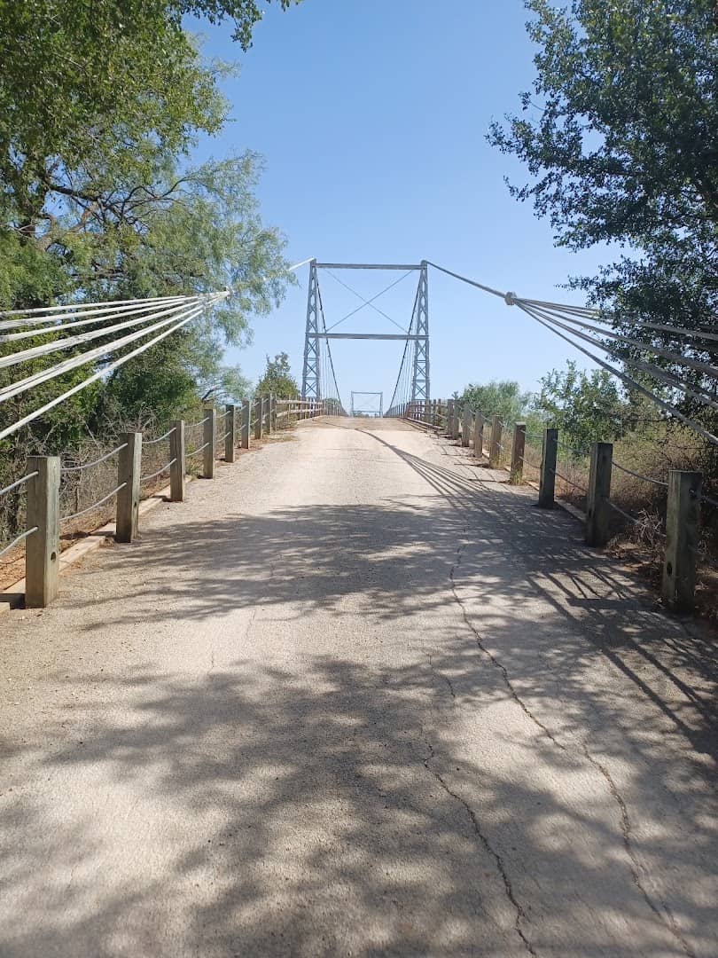 The gravel road approach to the Regency Suspension Bridge in the Texas Hill Country