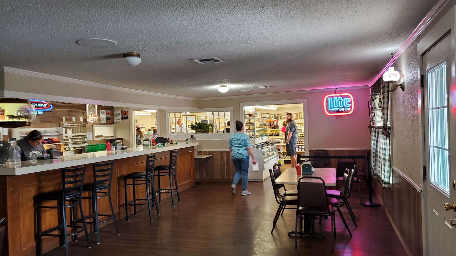The down-home dining room at Green's Sausage House with booths and tables