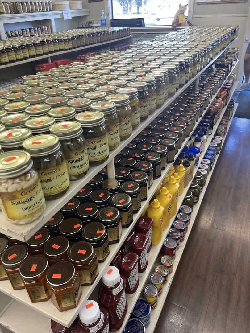 Shelves of Green's Sausage House pickled jalapenos, dilled green beans, and jams