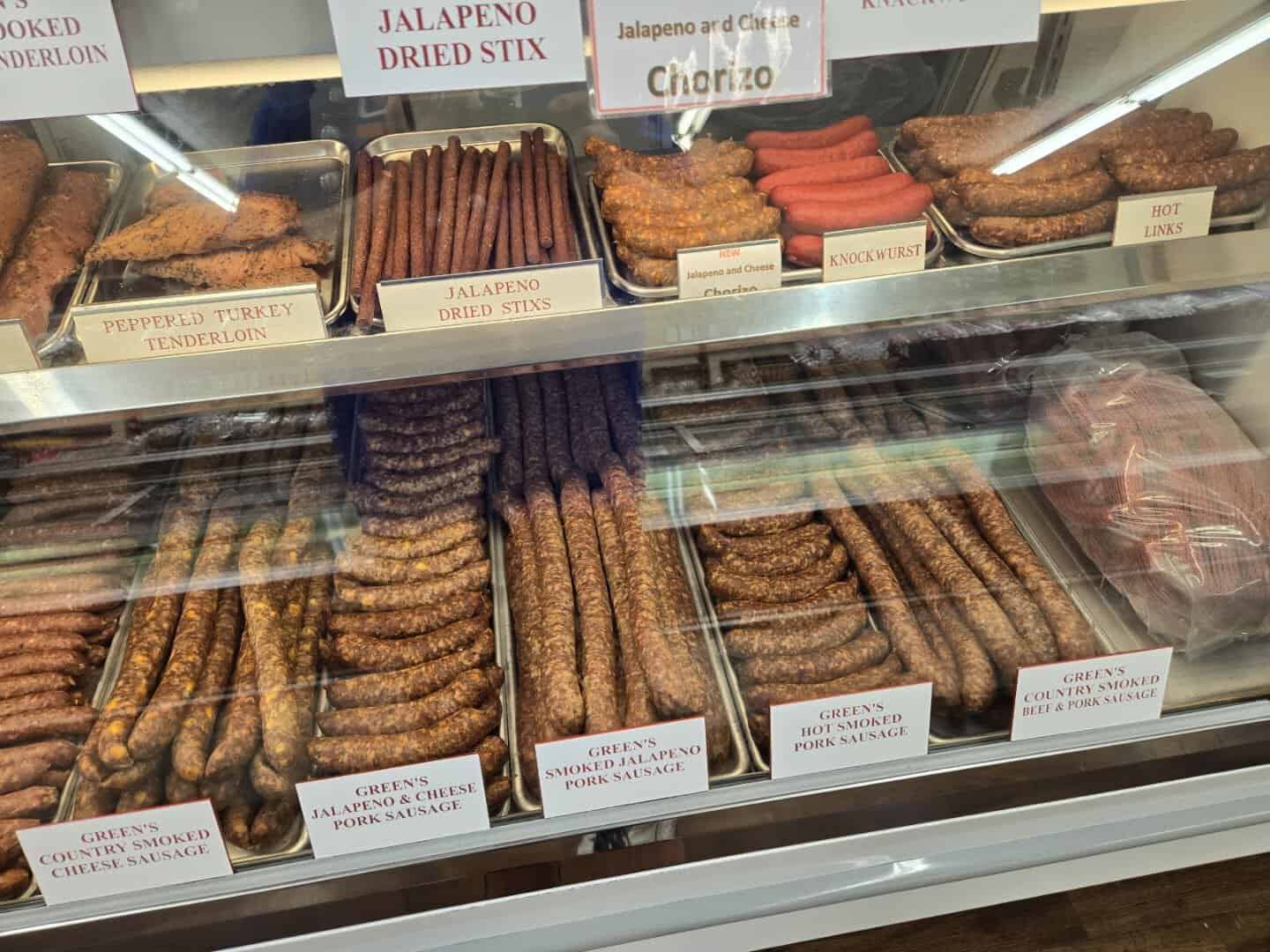Case of Green's house-smoked pork sausage, jalapeno cheese links, and dried stix