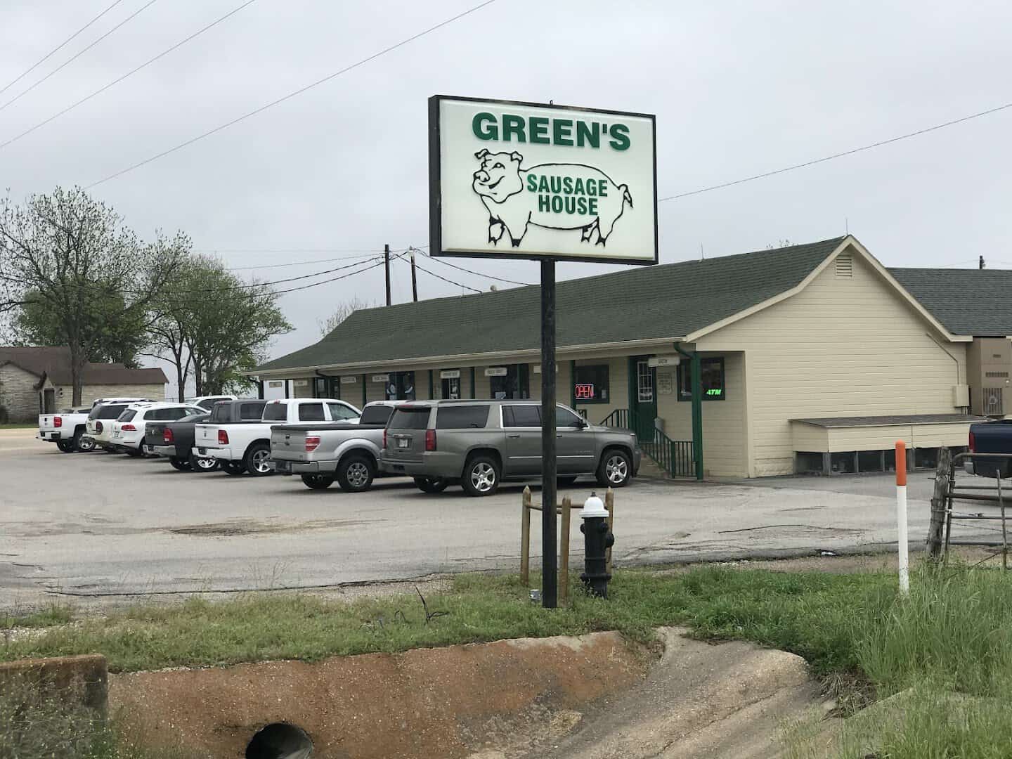 The Green's Sausage House storefront and sign on State Highway 53 near Temple, Texas