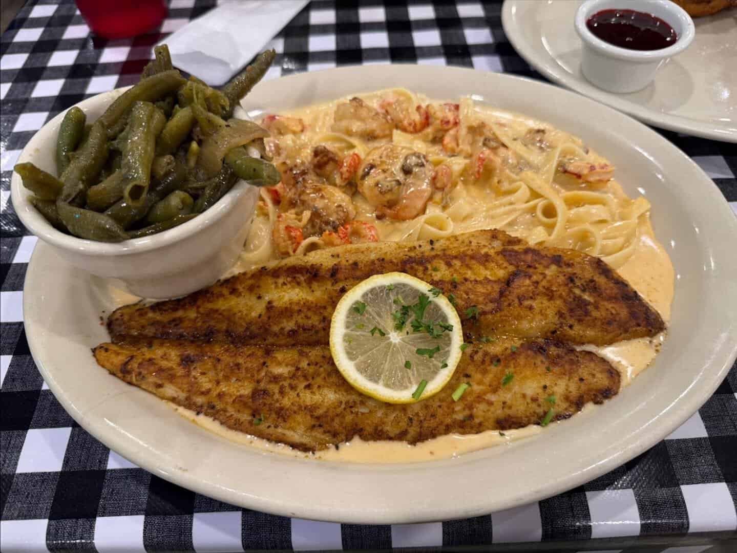 Blackened grilled catfish filet with lemon and green beans at Mels Country Cafe in Tomball, Texas
