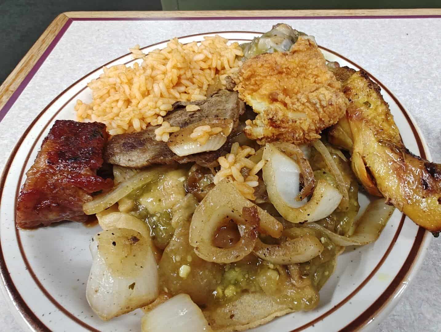 Plate of grilled meats, ribs and chile relleno at Ranchero King Buffet in Houston