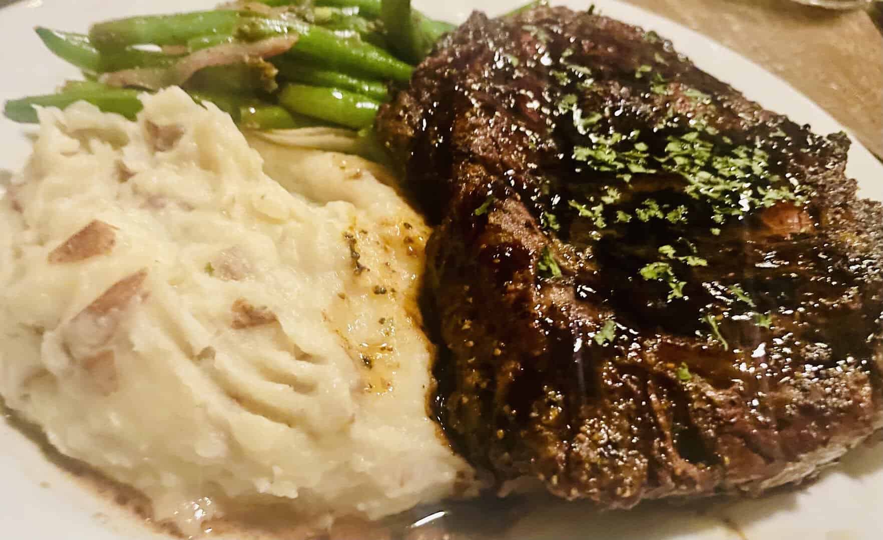 Grilled ribeye steak with mashed potatoes and green beans at Gruene River Grill in New Braunfels