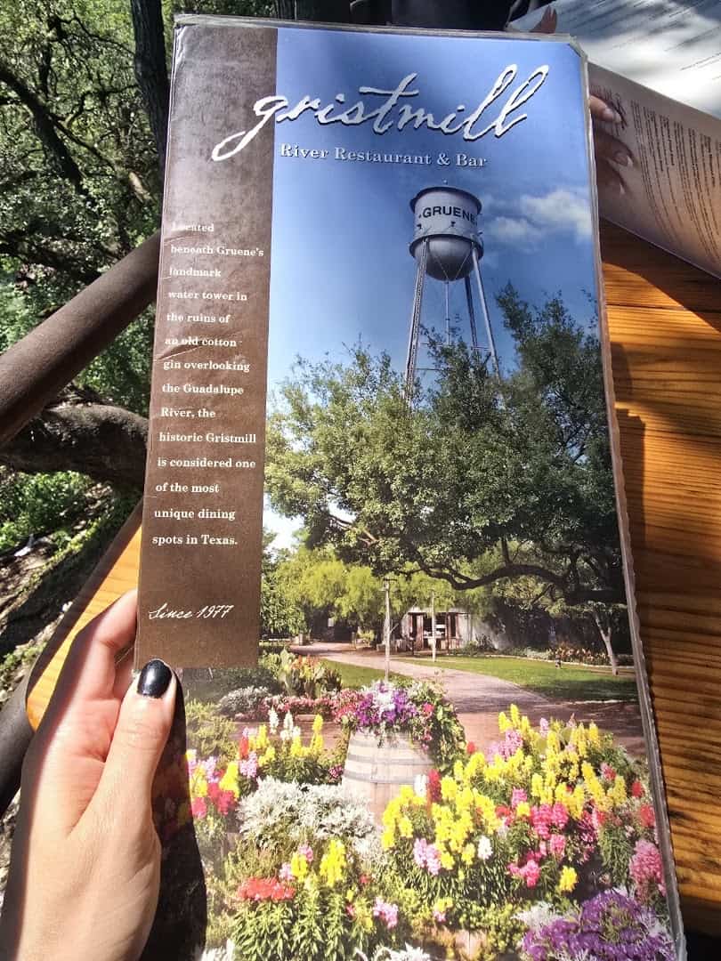 The Gristmill menu with the Gruene water tower on its cover