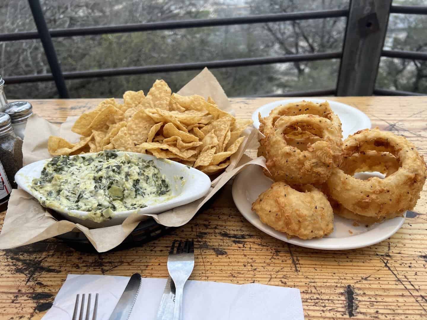 Golden onion rings and spinach artichoke dip at the Gristmill in Gruene, Texas