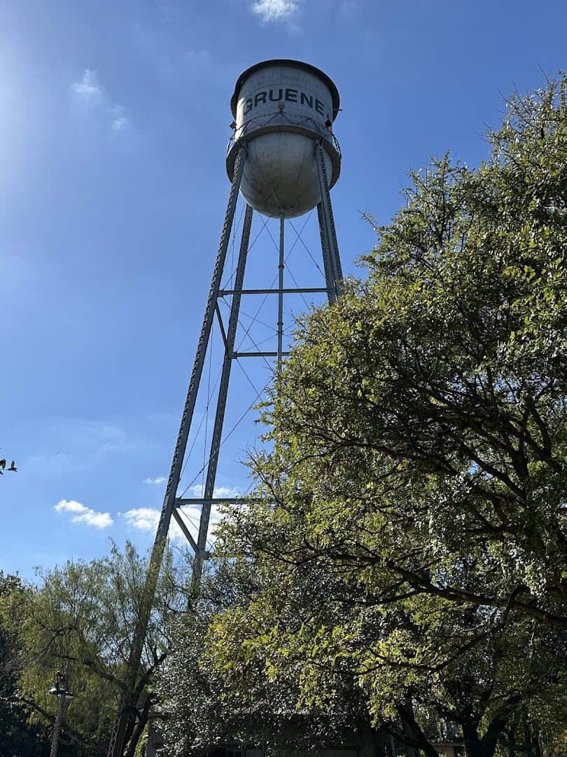 Gruene's landmark water tower rising above the trees