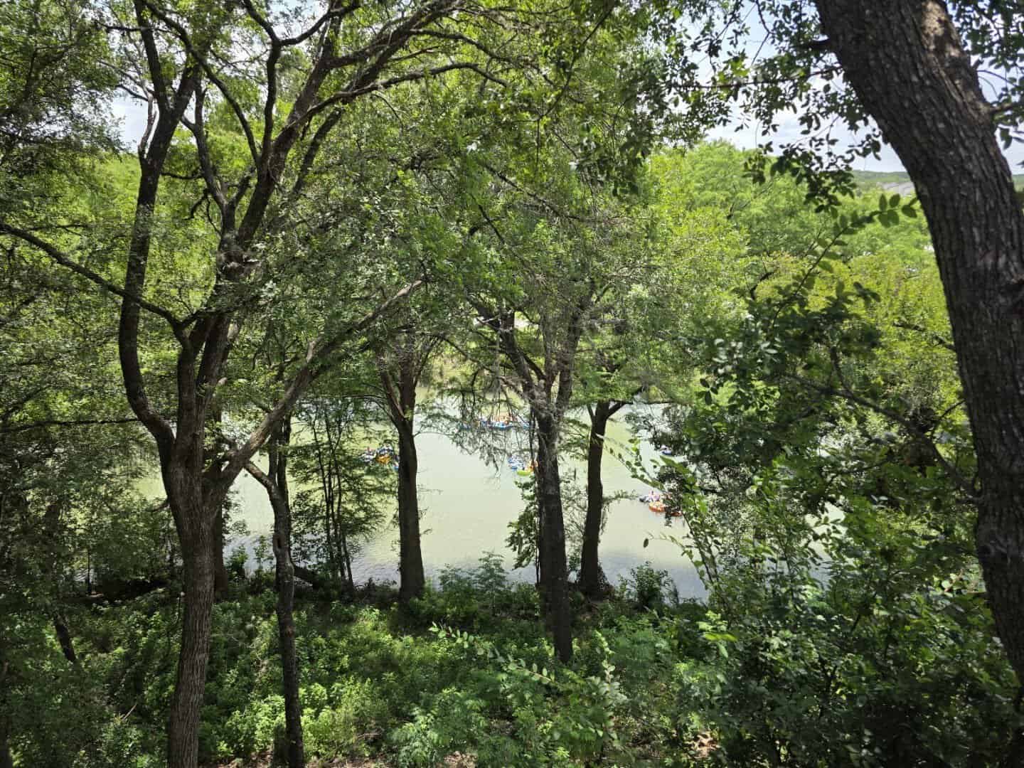 View of the Guadalupe River and summer tubers from the bluff at Gruene River Grill in New Braunfels