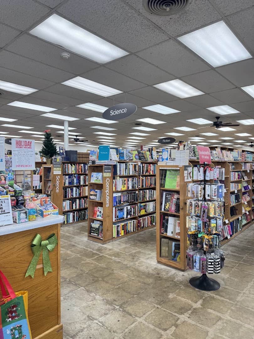 Rows of book shelves under Science and Fiction signs at the Half Price Books flagship in Dallas