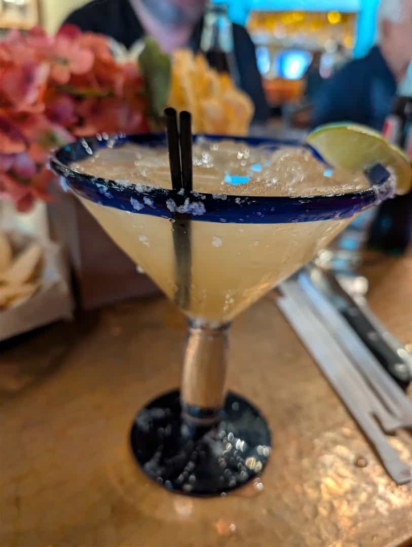 Handmade margarita in a blue-rimmed glass at Mi Familia at the Rim in San Antonio