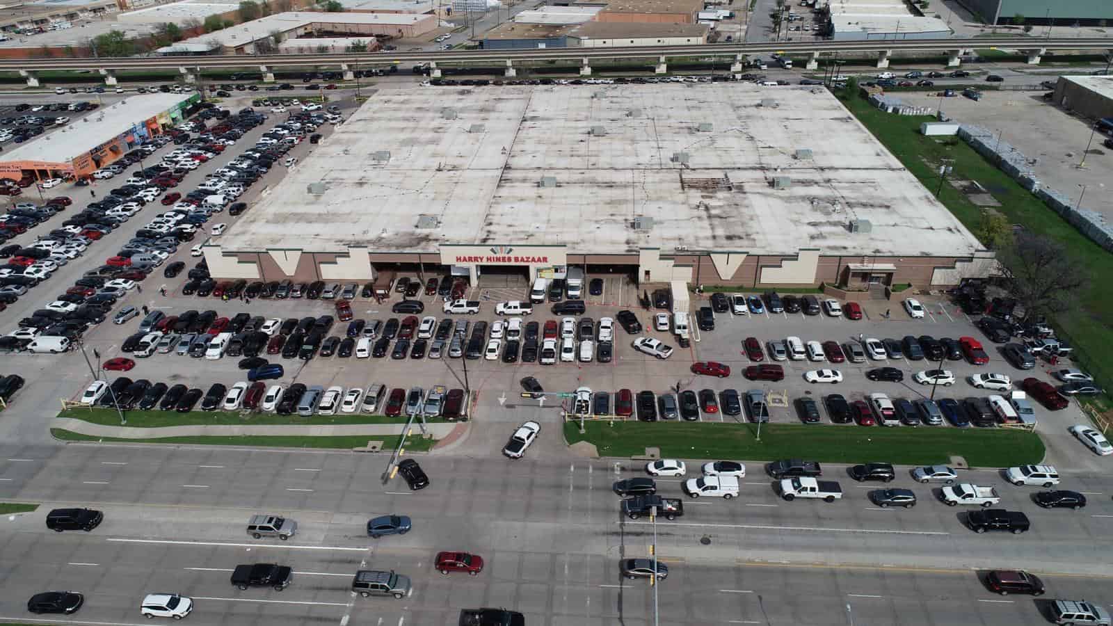 Aerial view of the Harry Hines Bazaar building and parking lot in Dallas