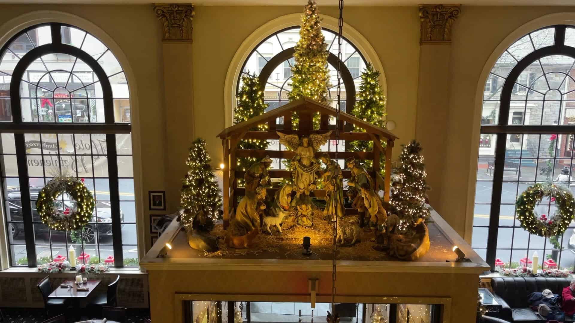 The Historic Hotel Bethlehem lobby decorated with lit Christmas trees and wreaths, Bethlehem, Pennsylvania