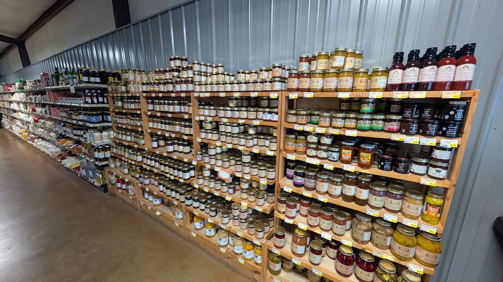 Shelves of jars of jams, jellies, pickles and sauces at Olde Towne Country Store in Itasca Texas