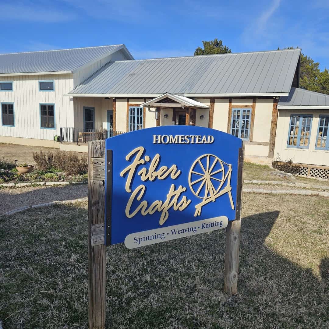 Homestead Fiber Crafts sign for spinning, weaving and knitting at Homestead Heritage near Waco, Texas