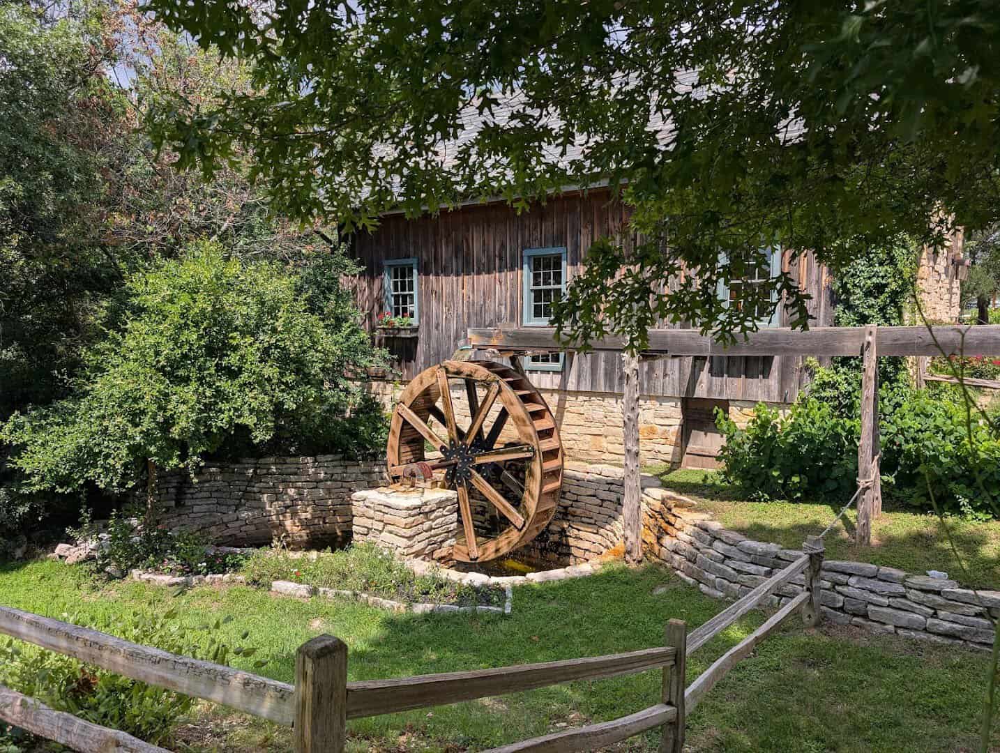 Water wheel of the Homestead Heritage gristmill near Waco, Texas