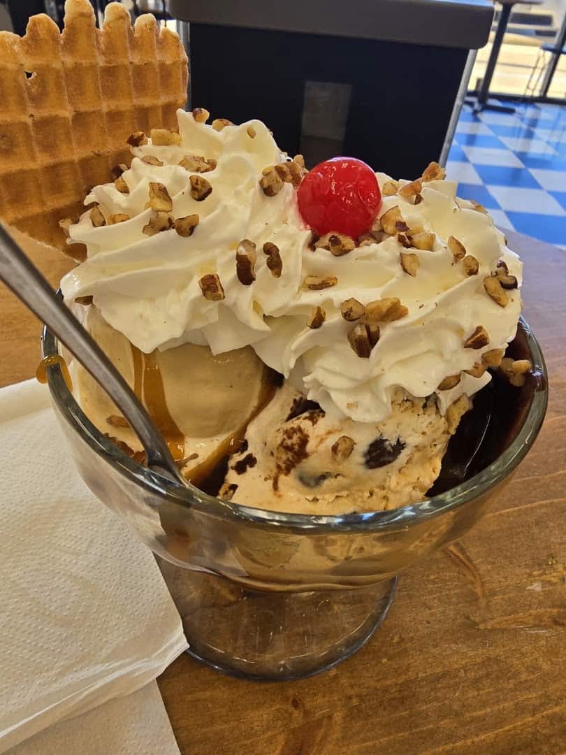 Hot fudge sundae with whipped cream, pecans and a cherry at Beth Marie's Old Fashioned Ice Cream in Denton