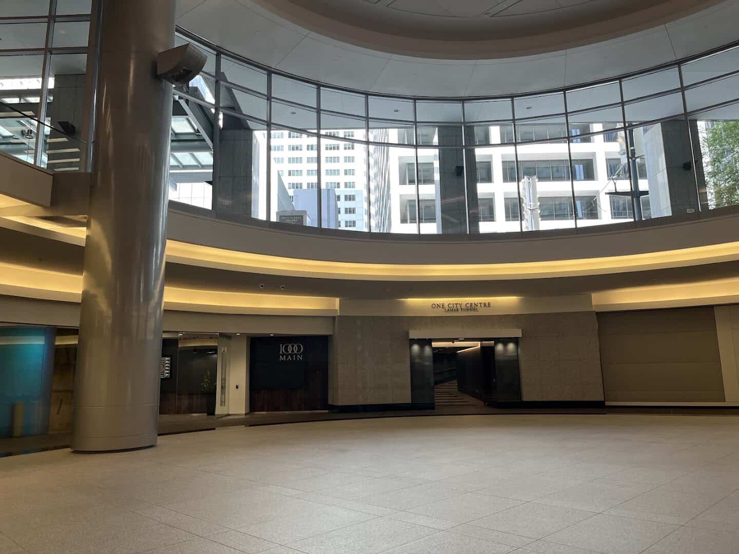 Tunnel-level lobby with wayfinding signs in downtown Houston