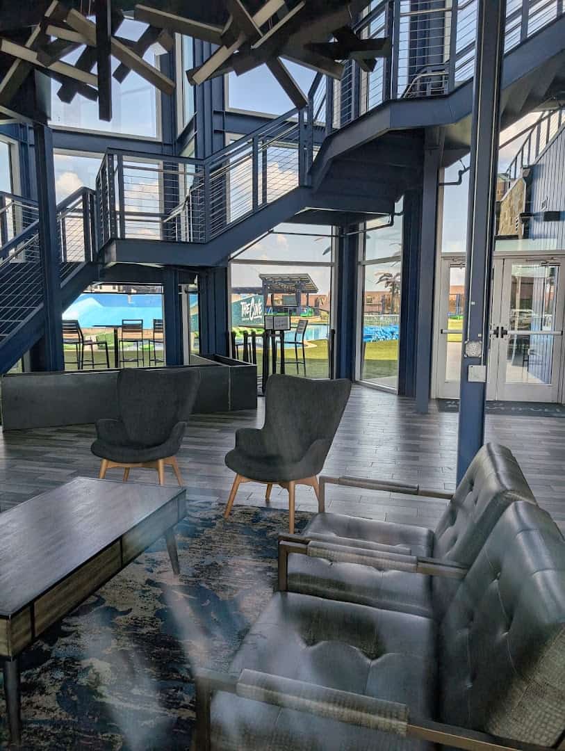 The interior lounge and stairway at The Cove at BearX in College Station, Texas