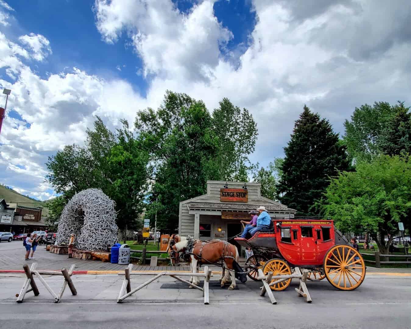 Elk antler arch and red stagecoach at the Town Square in Jackson, Wyoming
