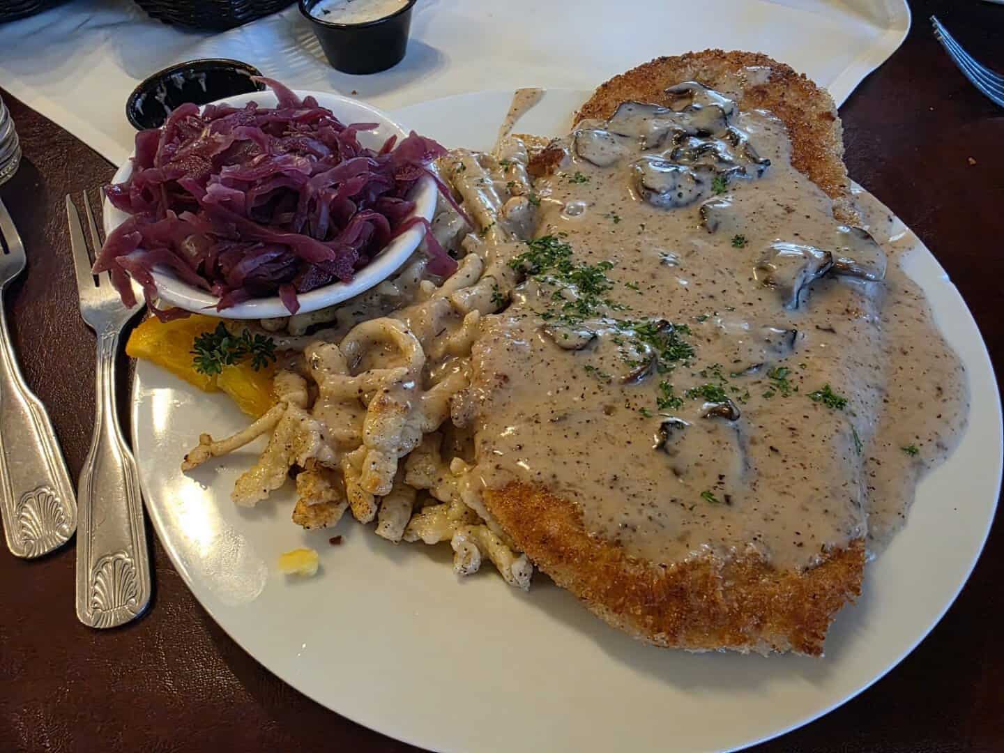 Jaegerschnitzel with mushroom gravy, spaetzle and red cabbage at Alpine Haus in New Braunfels, Texas