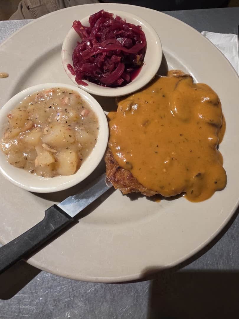 Jager schnitzel with mushroom gravy, potato salad and red cabbage at Rathskeller Bistro