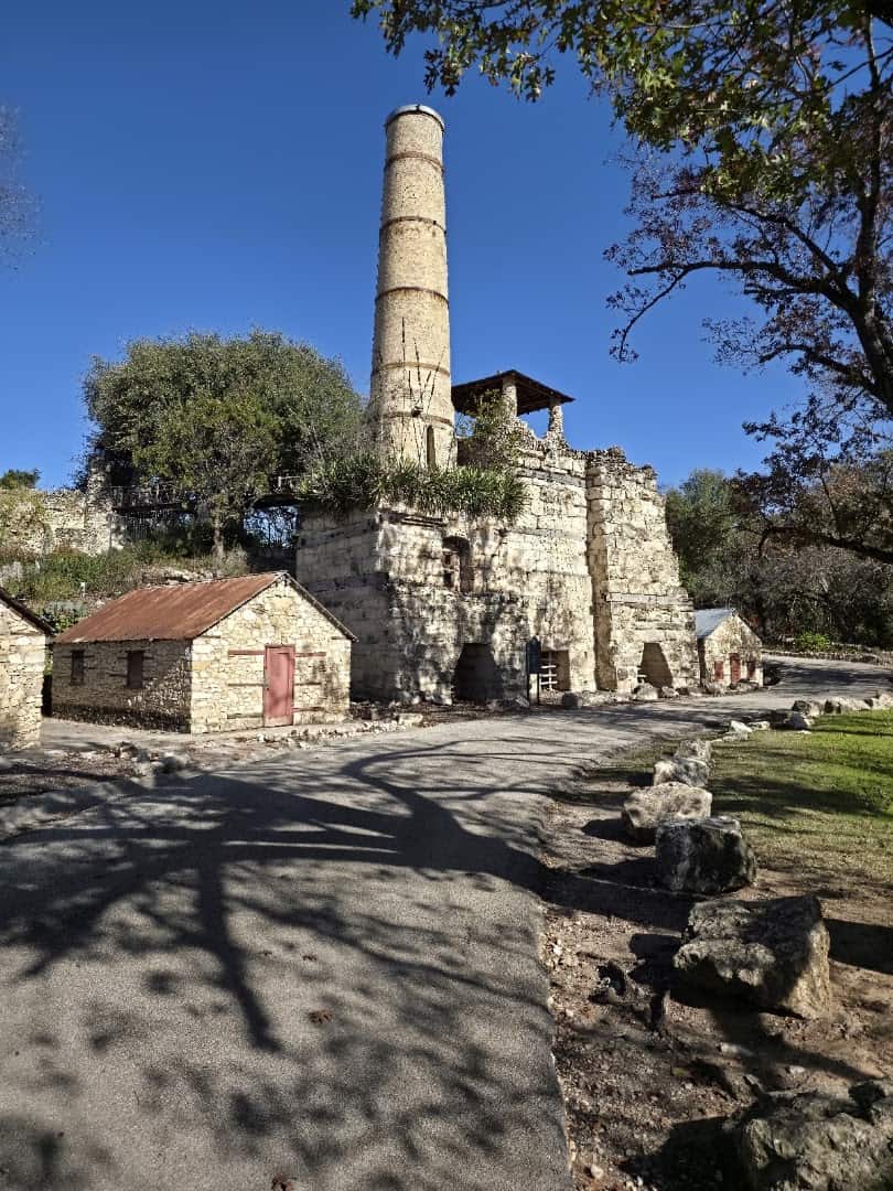 Historic cement quarry smokestack and stone ruins at the Japanese Tea Garden in San Antonio