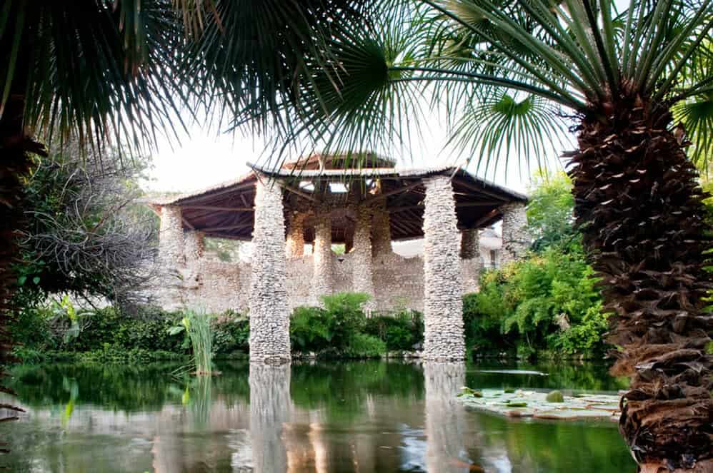 The stone pavilion rising over the pond at the Japanese Tea Garden in San Antonio