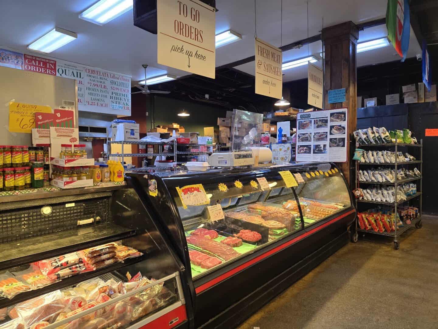 Deli counter and menu board at Jimmy's Food Store in Dallas